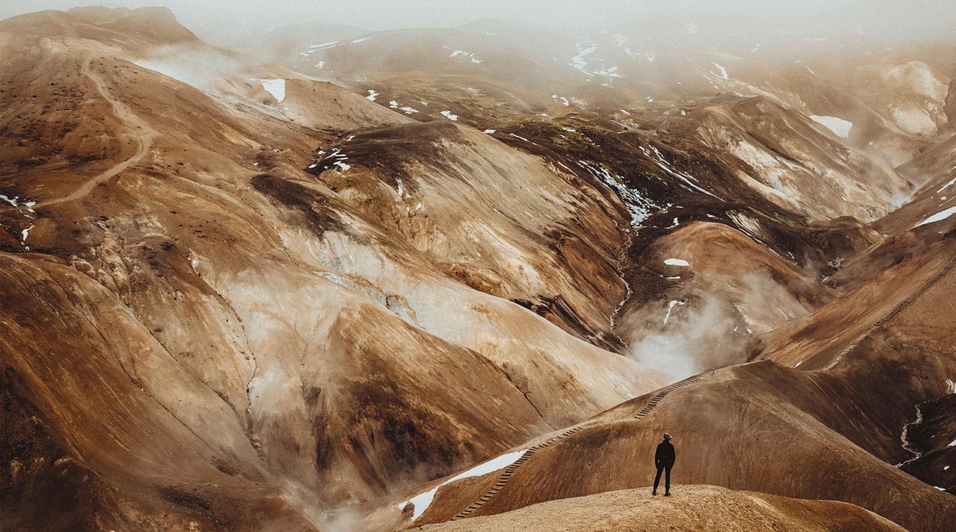 Person standing looking out at the Highlands of Iceland